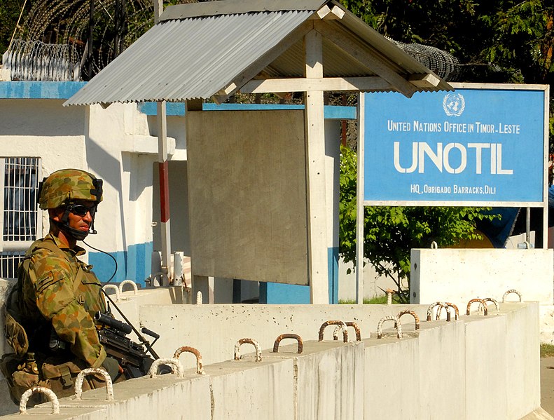 File:ISF soldier provides security to UNOTIL compound.jpg