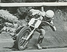 Roberts in 1974 competing in an AMA Grand National Championship dirt track event. Kenny Roberts (1413976084).jpg