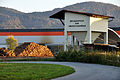 English: Woodpile and discharging patch for cereals at the train station Viktring Deutsch: Blochstapel und Entladestation für Gertreide am Bahnhof Viktring