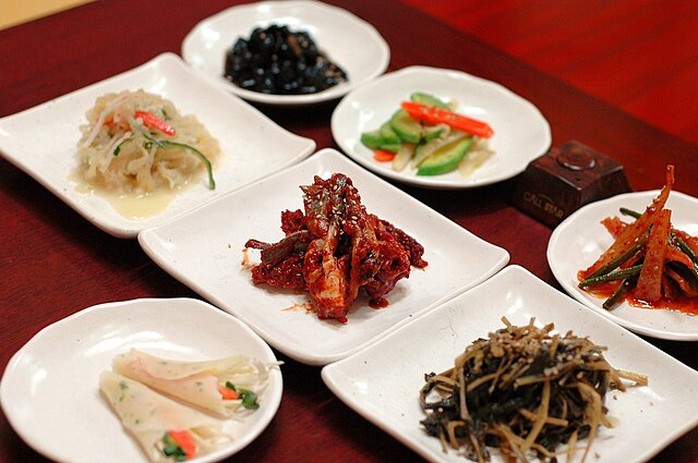 Various banchan served at a table