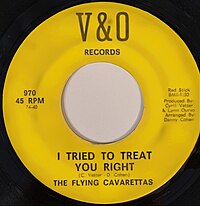 Yellow label on a vinyl record with black text for the 1966 musical single "I Tried to Treat You Right" performed by The Flying Cavarettas.