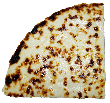 A quarter of leipäjuusto, the Finnish squeaky cheese.