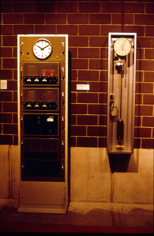The first Swiss quartz clock, which was made after World War II (left), on display at the International Museum of Horology in La Chaux-de-Fonds