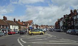 The main street in the former market town of Marlborough, Wiltshire is exceptionally wide, probably made, argues Hoskins, to hold the once regular sheep market. Many of the houses were rebuilt in brick or refronted with tiles in the 18th and 19th centuries. Marlborough Centre.jpg