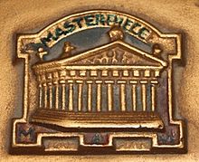 The Masterpiece logo as used by Monington and Weston. The photo is unclear, but at the bottom can just be made out "M & W". Monington and Weston Pianos Logo.jpg