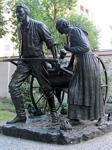 Mormon handcart pioneers are memorialized on Temple Square in Salt Lake City, Utah. Mormon Pioneer handcart statue.jpg