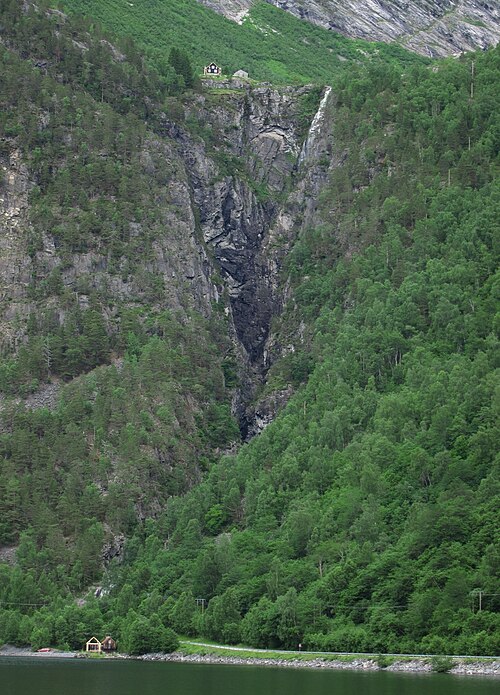 Muldalsfossen waterfall drops several hundred meters from the Muldalen hanging valley to Tafjorden.