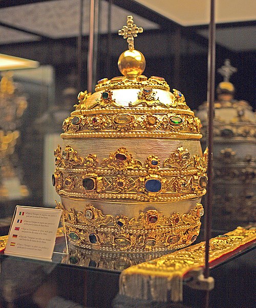 A papal tiara adorned with sapphires, rubies, emeralds and other gems, at the St. Peter's Basilica, Vatican City.