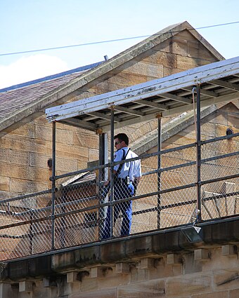 A prison guard on lookout in the watchtower at Parramatta Gaol.