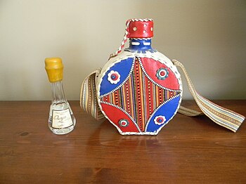 Quince rakija from Serbia in traditional flasks