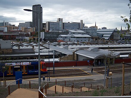 The station from the east. In the foreground are the Supertram stop and the station entrance hall. In the distance is the city centre.