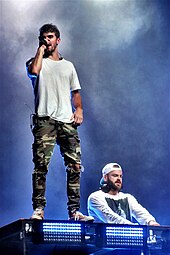 The band collaborated with DJ duo the Chainsmokers for the single "P.S. I Hope You're Happy" in 2019. The Chainsmokers Grandoozy 2018 (45208197432).jpg