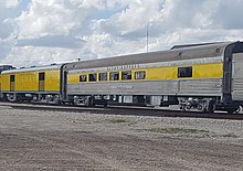 The two cars used on the Sugar Express; The Miami Locks open-air car (left) and the Palmdale lounge car (right) The Miami Locks and The Palmdale.jpg