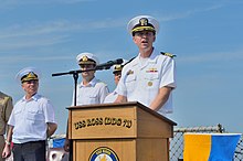 Commodore James Aiken, USN, COMDESRON 60 (8 September 2014) U.S. Navy Commodore James Aiken, at lectern, the commander of Destroyer Squadron 60 and the director of exercise Sea Breeze 2014, speaks during the opening ceremony for the exercise aboard the guided missile 140908-N-IY142-185.jpg