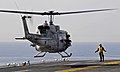 US Navy 100116-N-5345W-058 UH-1N Huey from the Sabers of Marine Light Attack Helicopter Squadron (HMLA) 467 prepares to touch down on the multi-purpose amphibious assault ship USS Bataan (LHD 5).jpg