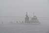 US Navy 111110-N-UM744-001 The Los Angeles attack submarine USS Springfield makes her way through the fog to return to homeport.jpg