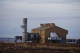 A gas pipeline compressor station. Gas is vented by design from the seals of some gas compressor equipment. Winslow Compressor Station, February 2019.jpg