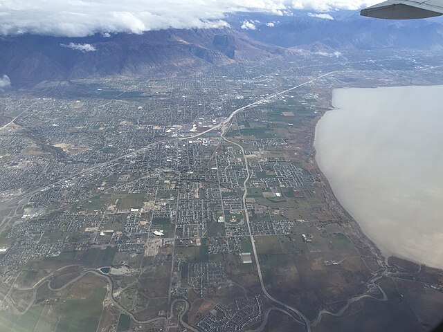View of the cities of Lehi, American Fork, Pleasant Grove, Lindon and Orem along Interstate 15 and the northeast shore of Utah Lake