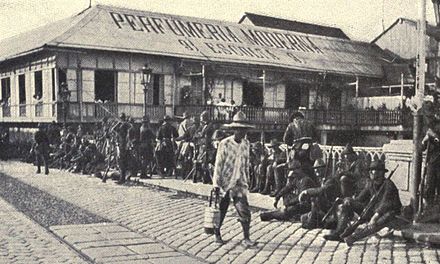 American troops guarding the bridge over the River Pasig on the afternoon of the surrender. From Harper's Pictorial History of the War with Spain, Vol. II, published by Harper and Brothers in 1899.