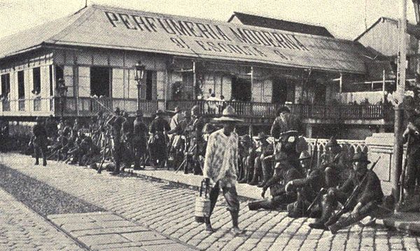 Photo of American soldiers guarding a bridge over the Pasig River after the battle, August 13, 1898