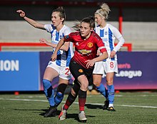 Toone (centre) playing for Manchester United against Brighton in 2019. BHA Women 0 Man Utd Women 2 WFAC 4th rd 03 02 2019-440 (33110591858).jpg