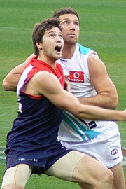 Lade (right) rucking against Melbourne's Stefan Martin in 2009 Brendon Lade and Stefan Martin ruck contest, Melb. v PA 2009-07-12 MCG (3722756965) (cropped).jpg