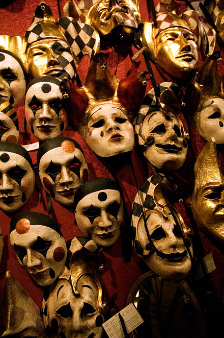 Typical masks worn at the Venice Carnival, which portray the satirical and exaggerated appearances often used.