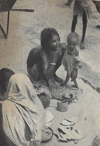 A family on the sidewalk in Calcutta during the Bengal famine of 1943