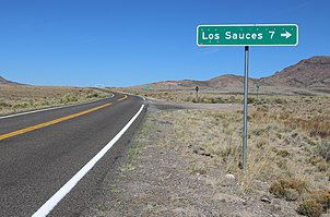 A sign along State Highway 142 indicating a turnoff for the community Distance road sign for Los Sauces.JPG