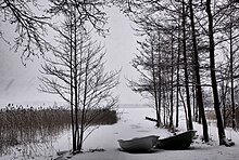 Winter: Boats on the shore of Lake Bodom.