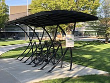 A green roof being used on a bike rack to keep bikes dry. Green roof bike rack.jpg