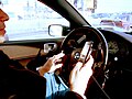 Image 34A driver using two handheld mobile phones at once (from Mobile phone)