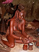   Himba lady preparing deodorant