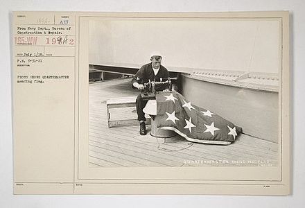 Quartermaster mending flag 1917-1918