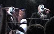 Adult males in black-and-white face paint