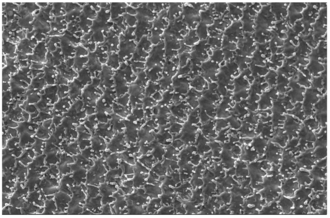 Commercially pure titanium roughened using a fiber laser .001 inch spacing, 100 inches/second speed - 500X magnification. Laser Roughening.png