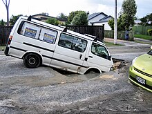 The effects of soil liquefaction, seen after 2011 Canterbury earthquake Liquefaction on roads - North New Brighton centre in Christchurch Feb 2011 quake.jpg