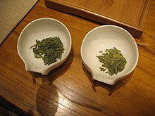 Longjing tea, also known as Dragon Well tea, is a variety of roasted green tea from Hangzhou, Zhejiang Province, China, where it is produced mostly by hand and has been renowned for its high quality, earning the China Famous Tea title. Longjing tea 3.jpg
