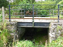 A steel underline bridge believed to be built circa 1892. It carries the Lostwithiel and Fowey branch line across a stream on Shirehall Moor at Lostwithiel Lostwithiel and Fowey bridge on Shirehall Moor.jpg
