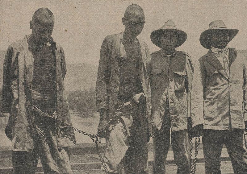 File:Lumbia (on left) following his arrest in 1926.jpg