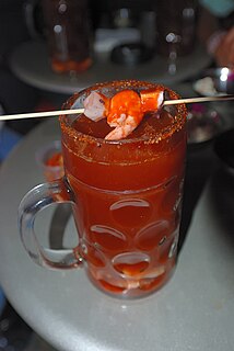 Michelada Mexican drink made with beer, lime juice, tomato juice, and spices