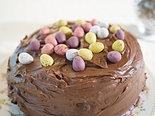 A chocolate cake decorated with Mini Eggs Mini Eggs on a chocolate fudge cake.jpg