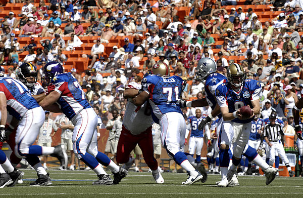 Action during the 2007 Pro Bowl, the all-star game of the National Football League. Note different team insignias on helmets.