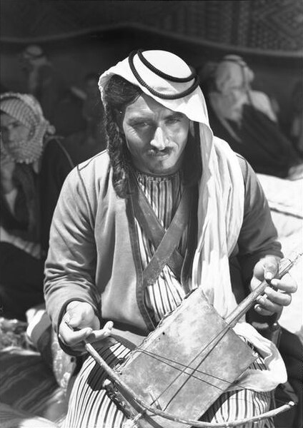 Bedouin playing a rebab during World War II