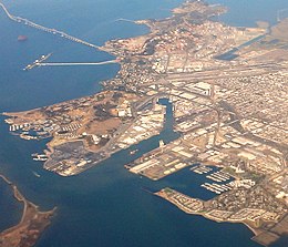 The Ford Assembly Plant is visible in the approximate center of this aerial photograph as the long building on the square point extending south into Richmond Harbor; to the east, the shoreline wraps around Marina Bay while Shipyard No. 3 is west across Harbor Channel. Richmond-California-aerial (Southern Shoreline and Marina Bay).jpg
