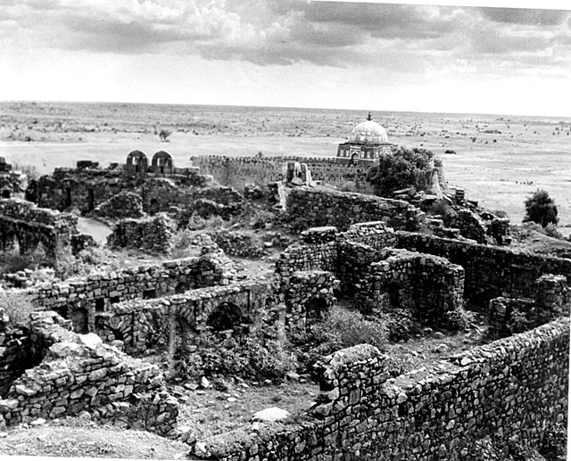 Ruins of Tughlaqabad Fort with Ghiyas-ud-din's tomb in the background, 1949