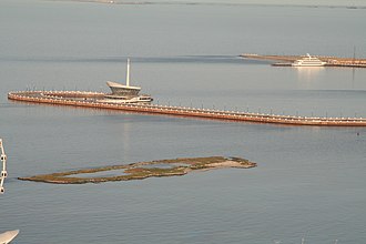 The vestiges of Sabayil Fortress as seen from the Baku Boulevard, with modern marina structures behind Sabayil Fortress.jpg