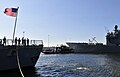 Sailors aboard USS Mason look on as USS Nicholas departs Naval Station Norfolk ahead of Hurricane Irene.jpg