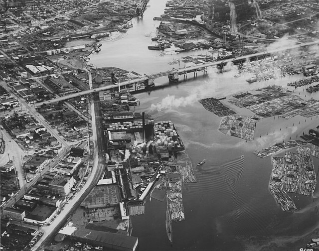 Looking the opposite direction, the Ballard Bridge and, at top of frame, Northern Pacific Railroad Ship Canal Bridge (bascule bridge, open here), 1950