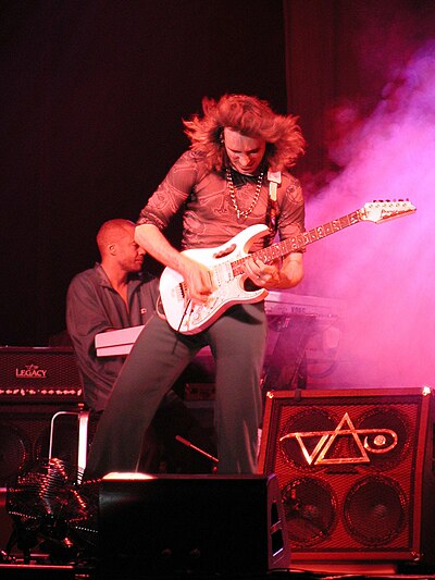 Vai performing in 2004